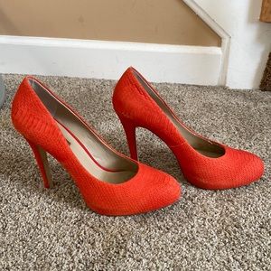 Used orange pumps